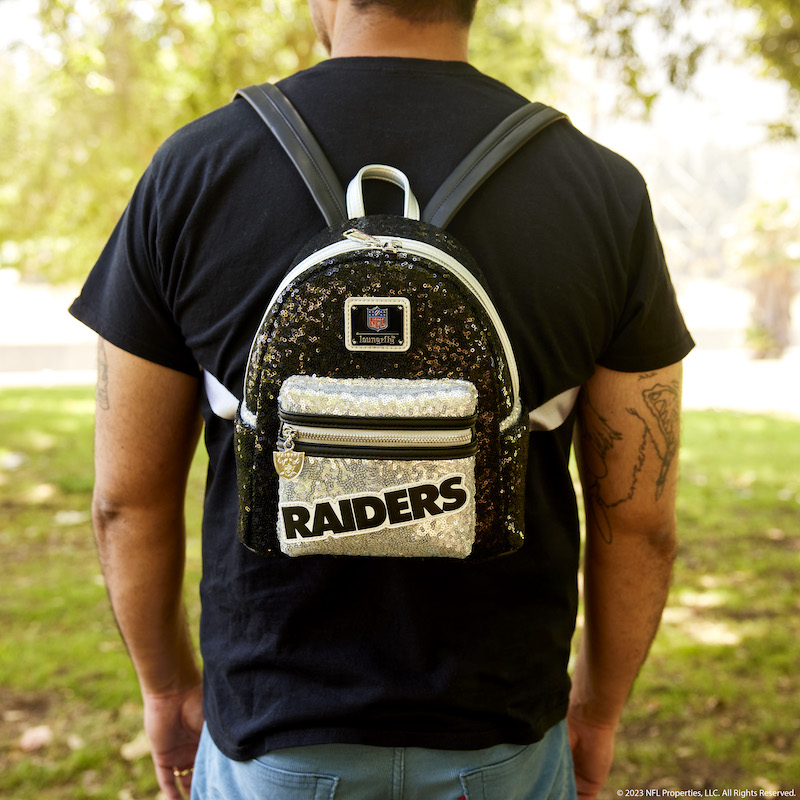 Man facing away from camera wearing the NFL Las Vegas Raiders Sequin Mini Backpack 